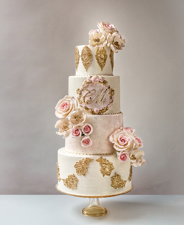 Stunning vintage pink and gold couture wedding cake in Greenwich, Connecticut. Designer Luxury Wedding Cakes by Ana Parzych.